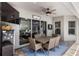 Inviting covered patio with a dining area, beverage cooler, and a view of the pool at 8840 Brookfield Ter, Bradenton, FL 34212