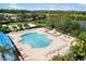 Aerial view of a large community pool and playground for outdoor enjoyment and amenities at 8840 Brookfield Ter, Bradenton, FL 34212
