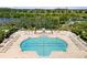 Aerial view of a large community pool with ample seating, lounging and playground for outdoor enjoyment at 8840 Brookfield Ter, Bradenton, FL 34212