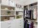 Walk-in closet with custom shelves, hanging racks and ample storage space at 8840 Brookfield Ter, Bradenton, FL 34212