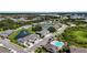 Community aerial view of pond, pool, and townhomes, showcasing the well-planned neighborhood at 8979 Milestone Dr, Sarasota, FL 34238