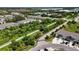 Aerial view highlighting a scenic walking path amidst lush greenery, offering a serene atmosphere at 8979 Milestone Dr, Sarasota, FL 34238