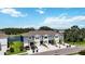 Aerial view of a townhome community offering stunning water features and beautifully designed living spaces at 8979 Milestone Dr, Sarasota, FL 34238