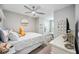 Well-lit bedroom features contemporary decor, a ceiling fan, and ample space at 8979 Milestone Dr, Sarasota, FL 34238