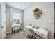 Stylish office space features a vanity, a desk, and a comfortable chair for an efficient workspace at 8979 Milestone Dr, Sarasota, FL 34238