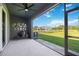View of the screened patio with a grill and a lovely water view creating a relaxing outdoor space at 8979 Milestone Dr, Sarasota, FL 34238