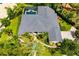 An aerial view reveals this home's luxurious roof, landscaping, and brick walkway at 8999 Wildlife Loop, Sarasota, FL 34238