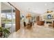Light-filled dining area with backyard and pool views through large sliding glass doors at 8999 Wildlife Loop, Sarasota, FL 34238