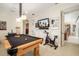Game Room with pool table, bike and TV at 8999 Wildlife Loop, Sarasota, FL 34238