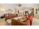 Spacious living room connected to the dining area and kitchen with an open floor plan at 8999 Wildlife Loop, Sarasota, FL 34238