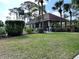 A charming clubhouse featuring a covered seating area and a well-maintained lawn at 900 La Costa Cir # 4, Sarasota, FL 34237