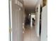 Inviting entryway featuring neutral tones, tile flooring, and a glimpse into the bright living area at 900 La Costa Cir # 4, Sarasota, FL 34237