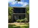 This building has screened patios and lush green vegetation surrounding it at 900 La Costa Cir # 4, Sarasota, FL 34237