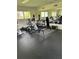 A modern gym equipped with stationary bikes, weights, and other fitness equipment at 900 La Costa Cir # 4, Sarasota, FL 34237
