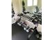 The gym has a rack of free weights with a mirror, exercise bands, and towels at 900 La Costa Cir # 4, Sarasota, FL 34237