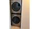Modern, stacked LG washer and dryer in a dedicated laundry area, offering space-saving convenience at 900 La Costa Cir # 4, Sarasota, FL 34237