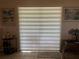 Bright living room with zebra shades filtering natural light at 900 La Costa Cir # 4, Sarasota, FL 34237