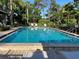 The community pool has plenty of lounge chairs and tables for relaxing at 900 La Costa Cir # 4, Sarasota, FL 34237