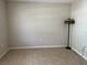 Empty room with tile floor and standing lamp at 900 La Costa Cir # 4, Sarasota, FL 34237
