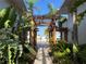 A lush garden walkway leads to the units in this building at 900 La Costa Cir # 4, Sarasota, FL 34237