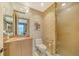 Bathroom features marble counters, tile, and shower at 990 Blvd Of The Arts # 801, Sarasota, FL 34236