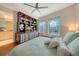 This primary bedroom offers a stunning view, built-in bookshelves, and calming colors at 990 Blvd Of The Arts # 801, Sarasota, FL 34236