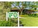 Charming Sarasota Garden Club building with lush gardens, providing a serene backdrop for community events at 990 Blvd Of The Arts # 801, Sarasota, FL 34236