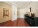 Refined hallway with rich wood floors, elegant decor and convenient access to the elevator at 990 Blvd Of The Arts # 801, Sarasota, FL 34236