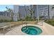Inviting hot tub surrounded by lush landscaping, offering a private and relaxing outdoor space at 990 Blvd Of The Arts # 801, Sarasota, FL 34236