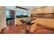 Bright kitchen features a center island, granite countertops and modern finishes at 990 Blvd Of The Arts # 801, Sarasota, FL 34236