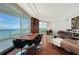 Spacious living area with a dining table and a window to offer panoramic ocean views at 990 Blvd Of The Arts # 801, Sarasota, FL 34236