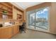 This office has custom built-ins and large sliding glass doors to the balcony at 990 Blvd Of The Arts # 801, Sarasota, FL 34236