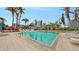 Large rectangular pool with lounge chairs, tropical plants and building in the background at 990 Blvd Of The Arts # 801, Sarasota, FL 34236