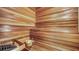 Wooden sauna with benches, a bucket, and a heating unit for a relaxing experience at 990 Blvd Of The Arts # 801, Sarasota, FL 34236