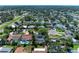 Community aerial view highlighting diverse housing and streetscapes with mature trees and nearby amenities at 10095 Nassau Ct, Seminole, FL 33776