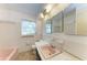 Bathroom featuring a pink sink, toilet, and tub at 10095 Nassau Ct, Seminole, FL 33776