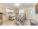 Bedroom featuring two twin beds with metal frames and linoleum flooring at 10095 Nassau Ct, Seminole, FL 33776