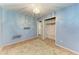Bedroom with blue walls, tile floors, and a closet with organizers at 10095 Nassau Ct, Seminole, FL 33776