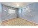 Cozy bedroom with blue walls, tile floors, and a quirky cloud motif at 10095 Nassau Ct, Seminole, FL 33776