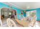 Bright dining room with colorful walls, a large table, and lots of natural light at 10095 Nassau Ct, Seminole, FL 33776