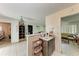Open floor plan featuring tile flooring, neutral walls, and a view into an adjacent bedroom and living room at 10095 Nassau Ct, Seminole, FL 33776
