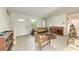 Tile floored room featuring vintage furniture and a view of the front door at 10095 Nassau Ct, Seminole, FL 33776