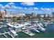 Stunning aerial of the marina showing multiple yachts, the yacht club and residential buildings in the background at 101 S Gulfstream Ave # 15C, Sarasota, FL 34236