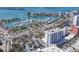 High angle view of marina, bridge, and waterfront building under a clear blue sky at 101 S Gulfstream Ave # 15C, Sarasota, FL 34236