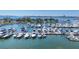Wide angle view of marina with boats docked under the blue sky and clear waters at 101 S Gulfstream Ave # 15C, Sarasota, FL 34236