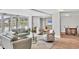 Bright amenity room with comfortable seating, large windows, and entertainment options at 101 S Gulfstream Ave # 15C, Sarasota, FL 34236