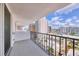 Balcony view of city buildings, blue skies and palm trees at 101 S Gulfstream Ave # 15C, Sarasota, FL 34236