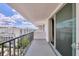 Spacious balcony with beautiful city skyline views, providing ample natural light through the sliding door at 101 S Gulfstream Ave # 15C, Sarasota, FL 34236