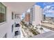 Balcony view overlooking city buildings and tree-lined streets at 101 S Gulfstream Ave # 15C, Sarasota, FL 34236