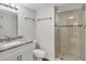 Bathroom with modern fixtures, granite countertops, and a glass-enclosed shower at 101 S Gulfstream Ave # 15C, Sarasota, FL 34236